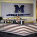 Jamie Kirts works the front desk for Michigan basketball at the Player Development Center during a tour on Tuesday. Melanie Maxwell I AnnArbor.com